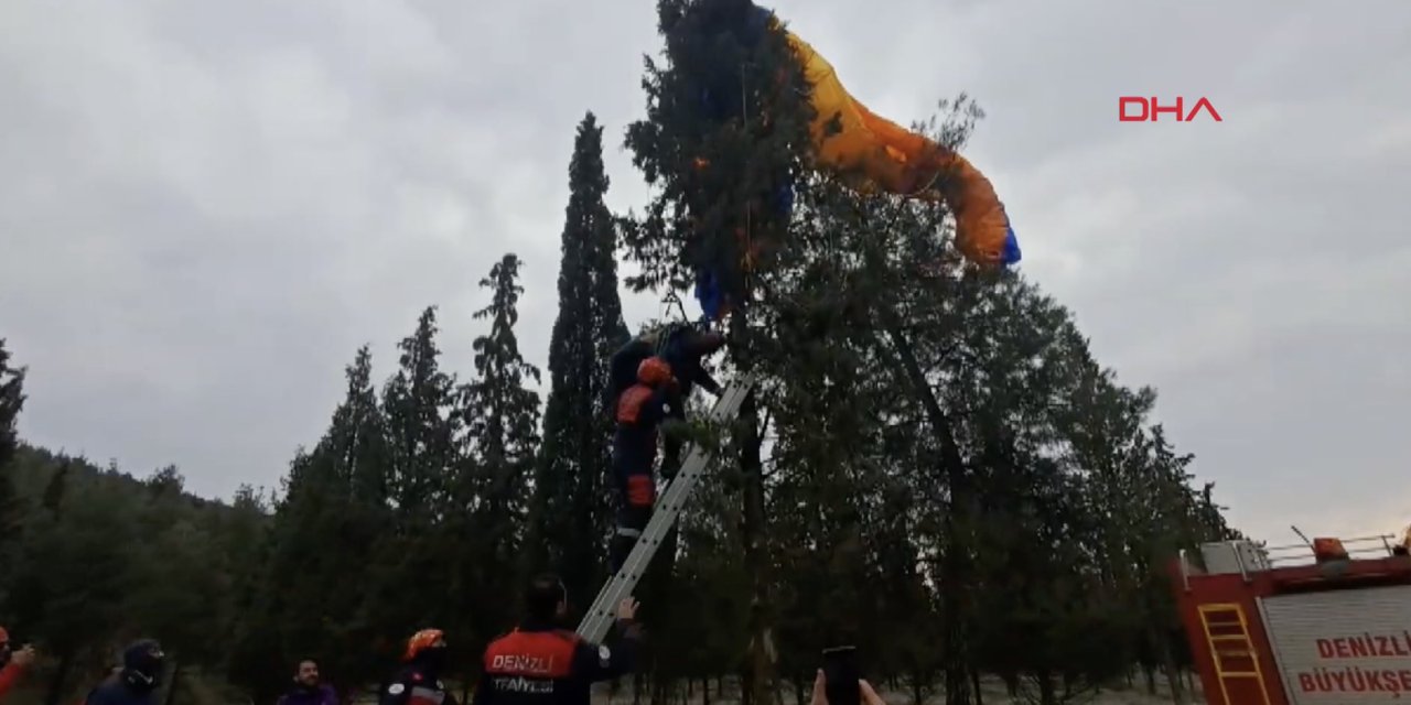 Pamukkale'de paraşütü ağaca takılan pilotu itfaiye kurtardı